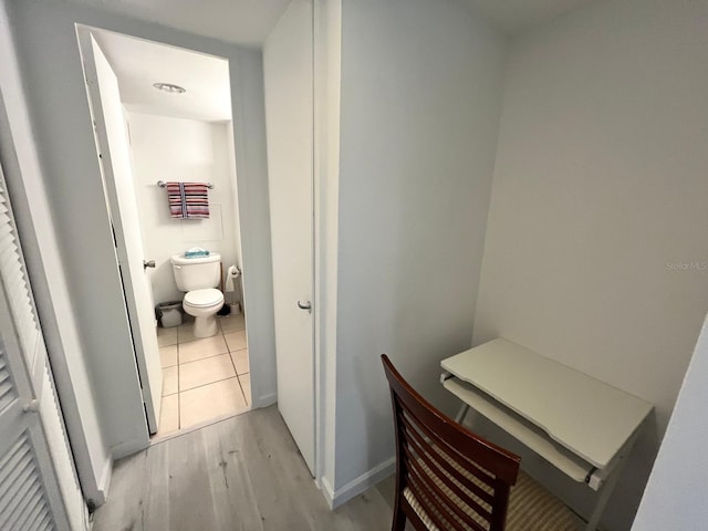 bathroom featuring toilet and wood finished floors