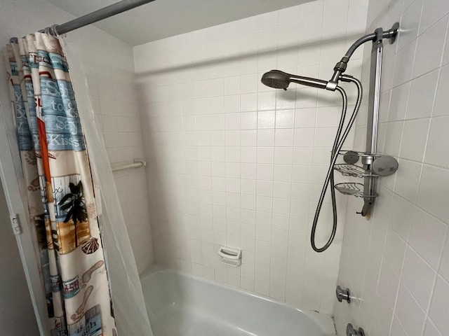 bathroom with shower / bathtub combination with curtain