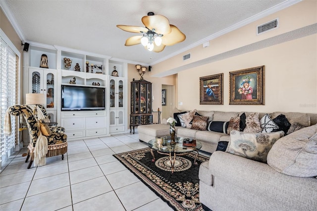10003 Vista Pointe Dr, Tampa, FL 33635 - living room featuring ornamental molding, light tile patterned floors, a ceiling fan, and a textured ceiling