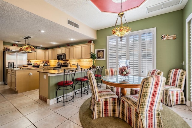 10003 Vista Pointe Dr, Tampa, FL 33635 - dining room with a textured ceiling, light tile patterned floors, and recessed lighting