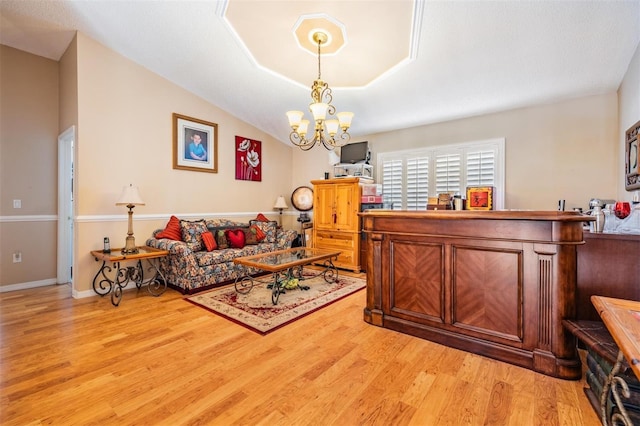 10003 Vista Pointe Dr, Tampa, FL 33635 - living room featuring light wood finished floors and a chandelier