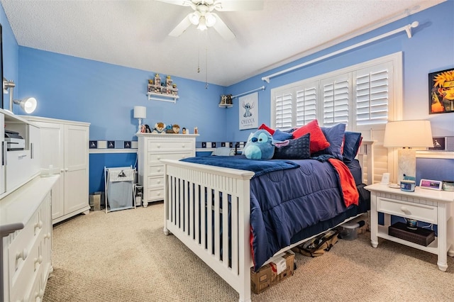 10003 Vista Pointe Dr, Tampa, FL 33635 - bedroom with light carpet, a ceiling fan, and a textured ceiling