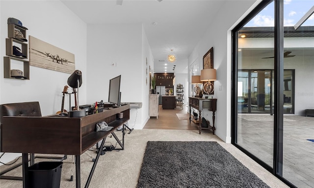 3610 Gulf City Rd, Ruskin, FL 33570 - home office with a wealth of natural light and carpet floors