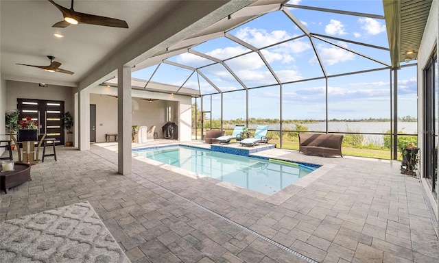 3610 Gulf City Rd, Ruskin, FL 33570 - pool featuring a lanai, a ceiling fan, a water view, and a patio area