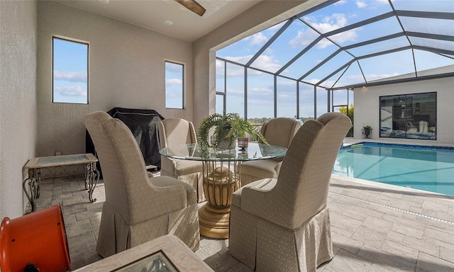 3610 Gulf City Rd, Ruskin, FL 33570 - outdoor pool with outdoor dining space, ceiling fan, a patio, and glass enclosure