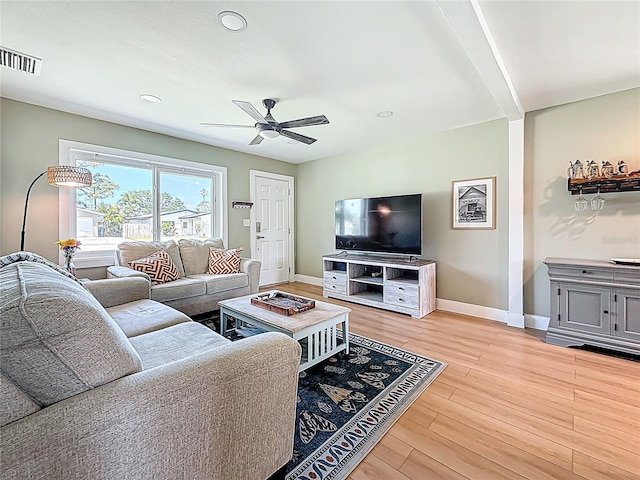 living room featuring recessed lighting, light wood-type flooring, a ceiling fan, visible vents, and baseboards