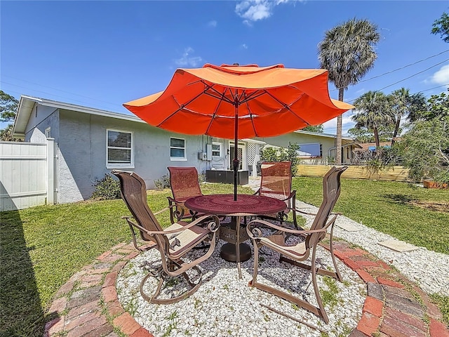 view of patio / terrace with outdoor dining space and fence