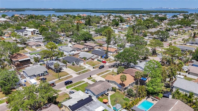 drone / aerial view with a residential view and a water view