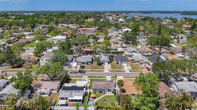 bird's eye view with a residential view and a water view