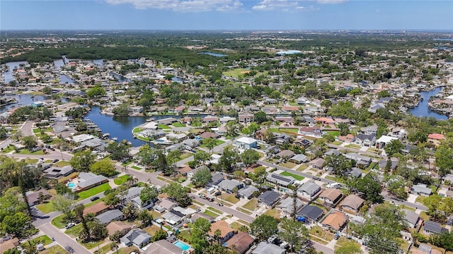 bird's eye view featuring a water view and a residential view