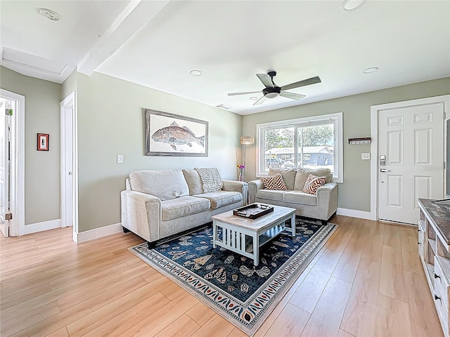 living area with a ceiling fan, light wood-style flooring, recessed lighting, and baseboards