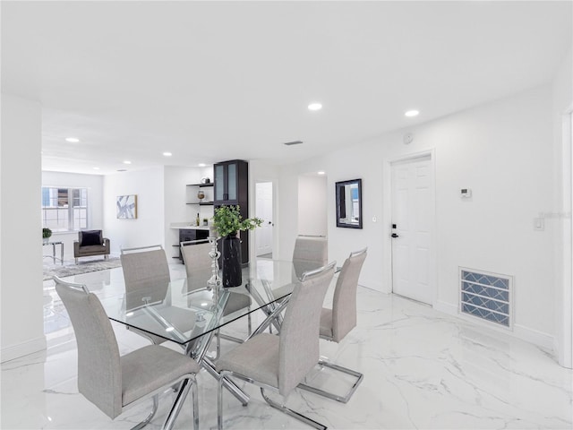 dining area with recessed lighting, visible vents, marble finish floor, and baseboards