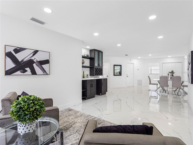 living area featuring marble finish floor, baseboards, visible vents, and recessed lighting