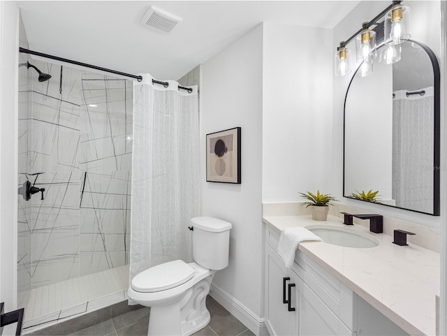 bathroom with toilet, curtained shower, vanity, and visible vents