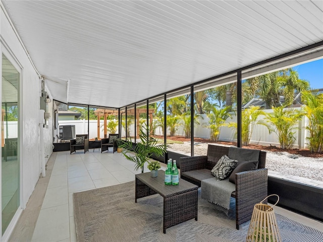 sunroom / solarium featuring outdoor lounge area and a wealth of natural light
