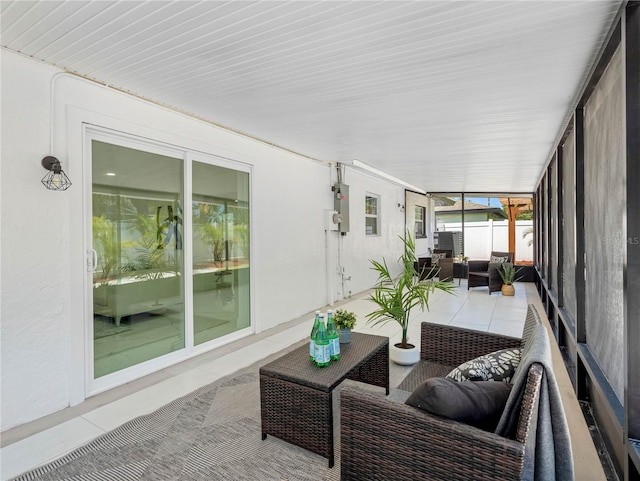 sunroom / solarium featuring an outdoor living space