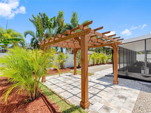 view of patio featuring fence and a pergola