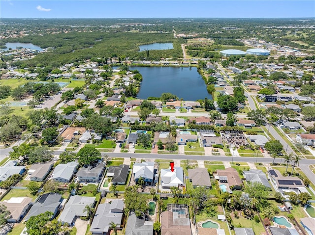 birds eye view of property with a residential view and a water view