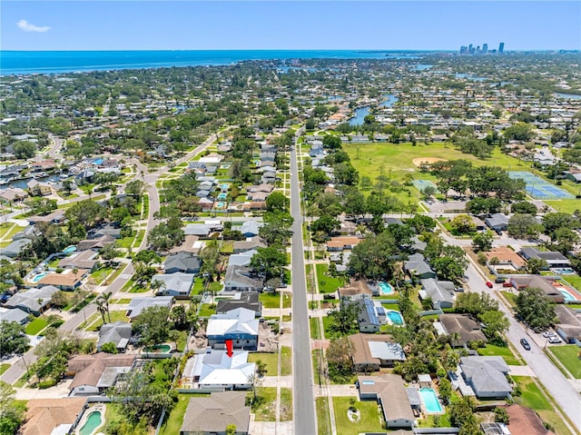 birds eye view of property with a residential view and a water view