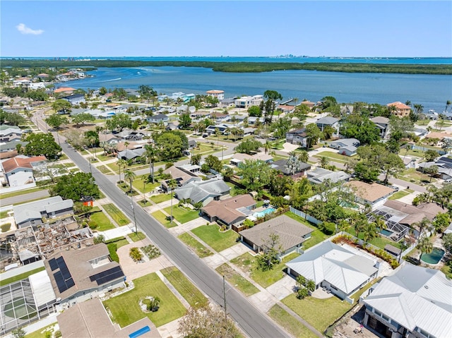 birds eye view of property featuring a water view and a residential view
