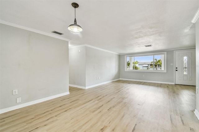 unfurnished living room featuring baseboards, visible vents, ornamental molding, and light wood-style floors