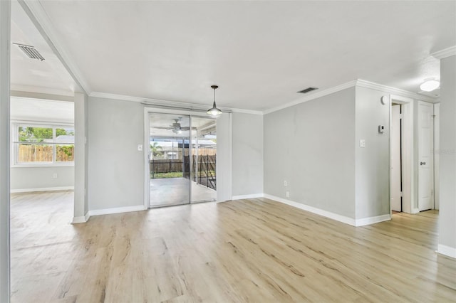 unfurnished living room with baseboards and visible vents