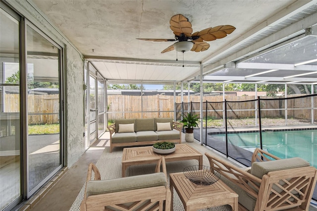 sunroom / solarium with an outdoor living space and ceiling fan