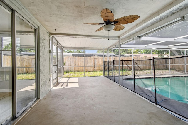 view of pool with a fenced backyard, ceiling fan, and a patio area