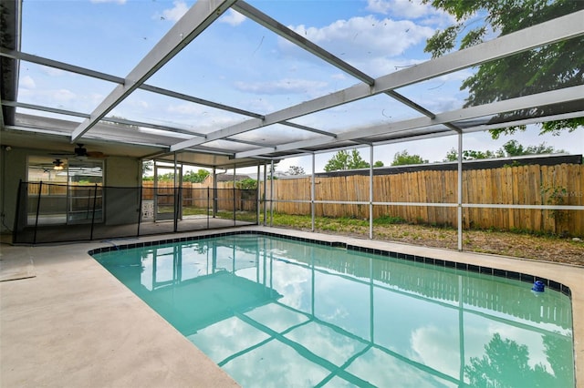 view of pool with fence, a patio, ceiling fan, a fenced in pool, and a lanai