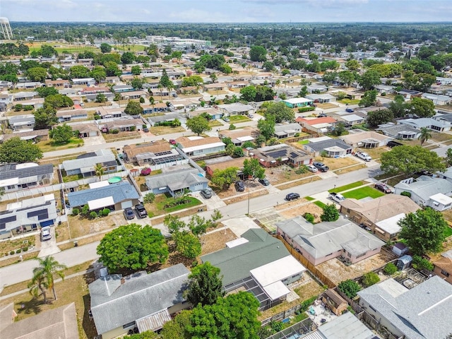 birds eye view of property with a residential view