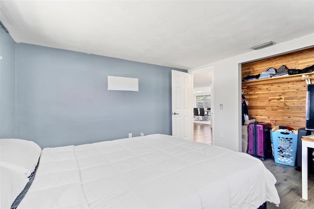 3654 Warbler Dr, New Port Richey, FL 34652 - bedroom featuring wood finished floors and visible vents