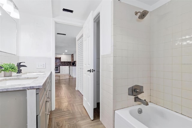 3654 Warbler Dr, New Port Richey, FL 34652 - bathroom featuring shower / bathtub combination, a sink, and double vanity