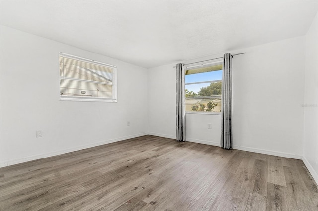 3654 Warbler Dr, New Port Richey, FL 34652 - empty room featuring wood finished floors and baseboards