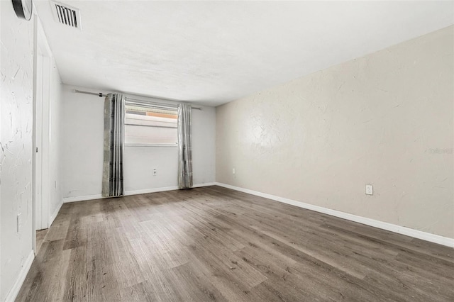 3654 Warbler Dr, New Port Richey, FL 34652 - empty room with wood finished floors and baseboards