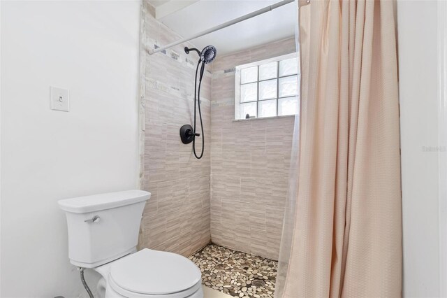 3654 Warbler Dr, New Port Richey, FL 34652 - full bath featuring a tile shower and toilet