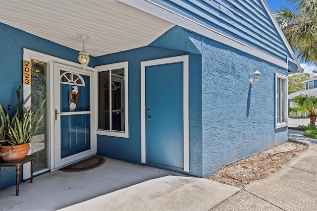 2023 Golfview Dr Unit 2023, Tarpon Springs, FL 34689 - entrance to property featuring stucco siding