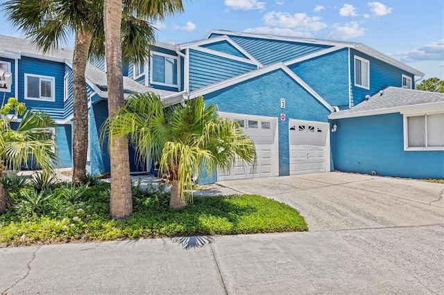 2023 Golfview Dr Unit 2023, Tarpon Springs, FL 34689 - view of front of property with driveway and a garage