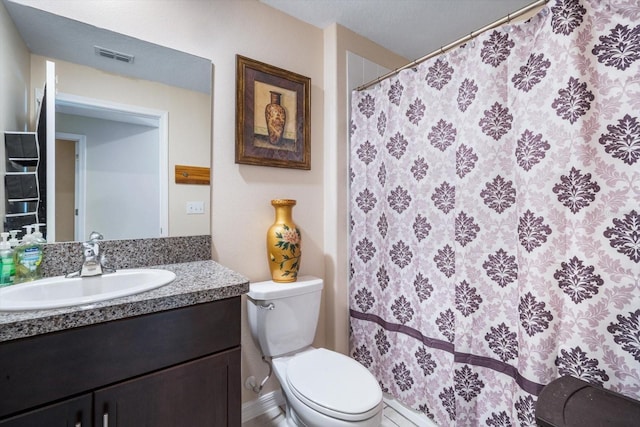 bathroom with toilet, vanity, a shower with shower curtain, and visible vents