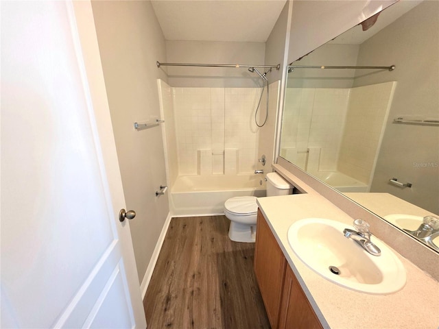 12604 Montford Ln, Riverview, FL 33579 - bathroom featuring toilet, shower / bathing tub combination, baseboards, wood finished floors, and vanity