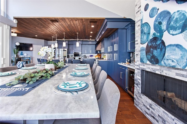 dining room with a fireplace, beverage cooler, dark wood-style flooring, and wood ceiling
