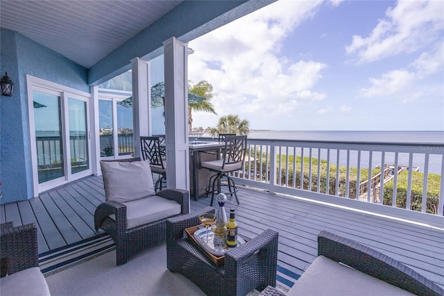 wooden deck with a water view