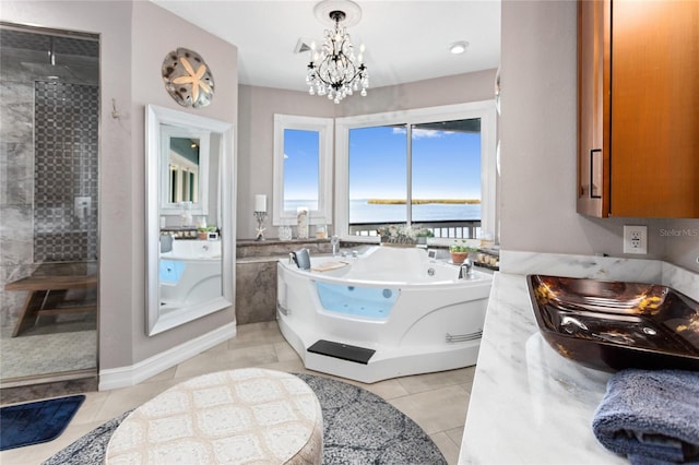 full bath with a tile shower, a water view, an inviting chandelier, a whirlpool tub, and tile patterned flooring