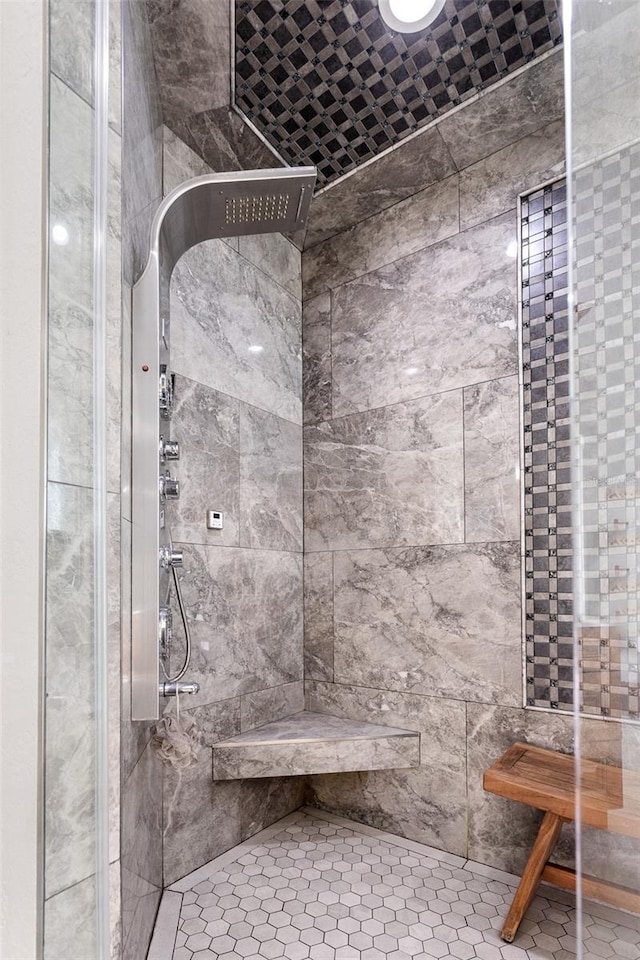bathroom with tiled shower