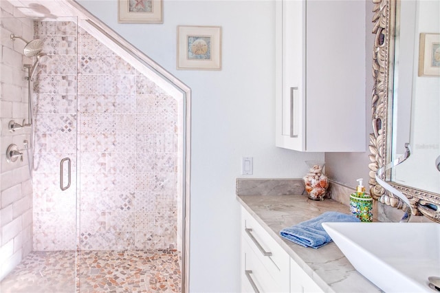 full bathroom with a stall shower and a sink