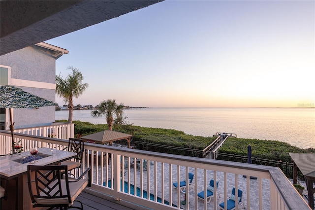 deck featuring a water view