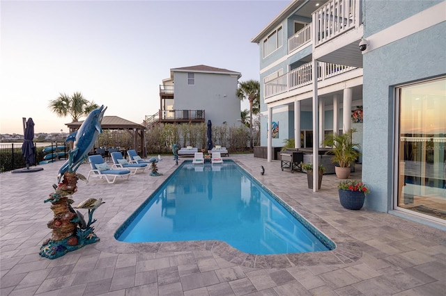 view of pool with a fenced in pool, a patio, a gazebo, and a fenced backyard