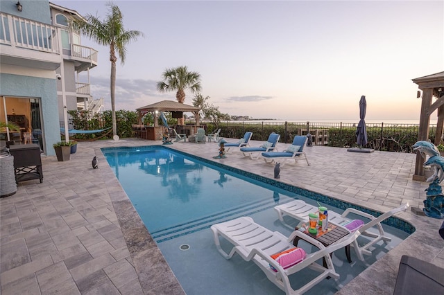 view of pool featuring fence, a gazebo, a patio area, and a fenced in pool