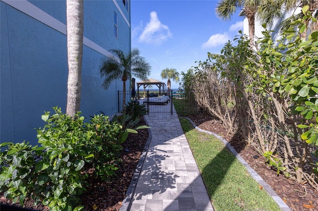 view of yard featuring fence and a gazebo
