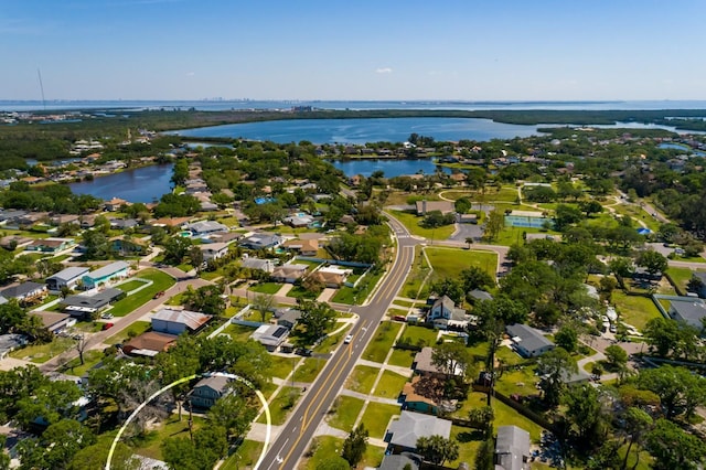 drone / aerial view featuring a residential view and a water view