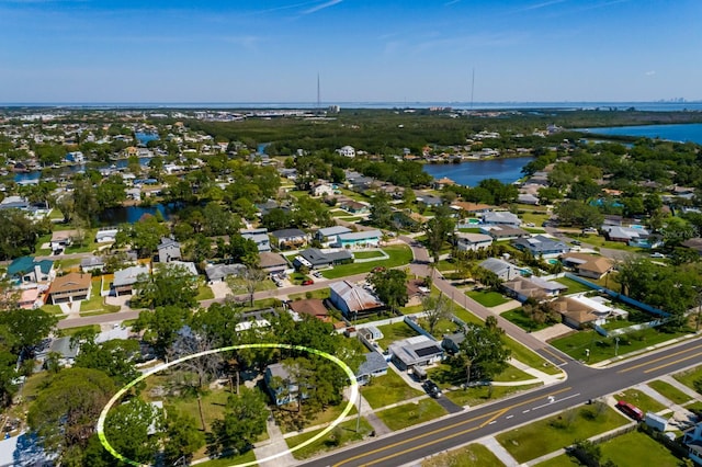drone / aerial view featuring a water view and a residential view